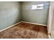 Small bedroom featuring neutral walls, carpet, and a single window at 151 N 8Th Ave, Beech Grove, IN 46107