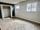 Bedroom with neutral walls, linoleum floors, two windows, and a closet at 151 N 8Th Ave, Beech Grove, IN 46107