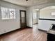 Dining room featuring hardwood floors, neutral walls, and an archway leading to the living room at 151 N 8Th Ave, Beech Grove, IN 46107