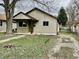 Charming single-story home featuring neutral siding, a covered porch, and a compact front yard at 151 N 8Th Ave, Beech Grove, IN 46107