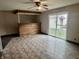 Living room with a built-in bar, linoleum floors, and a sliding glass door at 151 N 8Th Ave, Beech Grove, IN 46107