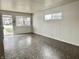 Bright living room with neutral walls, large windows, and vinyl floors at 151 N 8Th Ave, Beech Grove, IN 46107