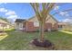 View of the home's exterior and backyard with a well-manicured lawn at 153 Monticello Ct, Noblesville, IN 46060