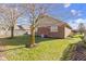 Brick home exterior featuring a well-maintained backyard and manicured lawn at 153 Monticello Ct, Noblesville, IN 46060