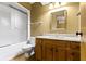 This bathroom features a golden wall color, a wood vanity, a mirror, and a shower at 153 Monticello Ct, Noblesville, IN 46060