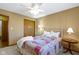 This cozy bedroom features a window, ceiling fan, and closet at 153 Monticello Ct, Noblesville, IN 46060