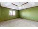 Empty bedroom showcases carpeted floors, tray ceiling, and natural light at 153 Monticello Ct, Noblesville, IN 46060
