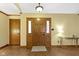 Inviting foyer featuring a wood door with glass inserts, hardwood flooring, and neutral paint at 153 Monticello Ct, Noblesville, IN 46060