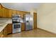 Corner view of the kitchen features stainless steel appliances and plenty of cabinets at 153 Monticello Ct, Noblesville, IN 46060