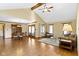 Spacious living room with vaulted ceiling, hardwood floors, and comfortable seating area near dining room at 153 Monticello Ct, Noblesville, IN 46060