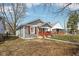 Lovely home with charming red shutters and a cozy front porch, perfect for relaxing at 1540 N Chester Ave, Indianapolis, IN 46201