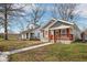 Quaint single-Gathering home with a welcoming front porch and a well-maintained lawn at 1540 N Chester Ave, Indianapolis, IN 46201