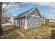 Detached garage with gray siding and a durable roof, offering ample storage space at 1540 N Chester Ave, Indianapolis, IN 46201
