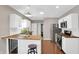 Modern kitchen with white cabinets, stainless steel appliances, and butcher block countertops at 1540 N Chester Ave, Indianapolis, IN 46201