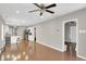 Spacious living room with hardwood floors seamlessly connected to the kitchen and dining area at 1540 N Chester Ave, Indianapolis, IN 46201