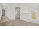 Upstairs hallway with carpet flooring, white walls, natural lighting, and an open doorway to a bedroom at 15982 Meadow Frost Ct, Fishers, IN 46037