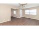 Inviting living room featuring laminate flooring, natural light, and neutral colored walls at 1701 Nelson Ave, Indianapolis, IN 46203