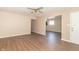 Spacious living room featuring laminate flooring, a ceiling fan, and neutral colored walls at 1701 Nelson Ave, Indianapolis, IN 46203