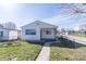 Charming single-story home featuring a well-maintained front yard with walkway, and an inviting covered entry at 1701 Nelson Ave, Indianapolis, IN 46203