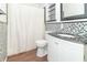 Bathroom with mosaic tile wall and modern vanity at 1701 Nelson Ave, Indianapolis, IN 46203