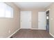 Light-filled bedroom with hardwood floors and closet at 1701 Nelson Ave, Indianapolis, IN 46203