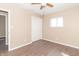 Bright bedroom with hardwood floors, ceiling fan, window, and closet at 1701 Nelson Ave, Indianapolis, IN 46203
