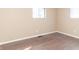 This bedroom features dark wood floors, neutral walls, and two windows offering plenty of natural light at 1701 Nelson Ave, Indianapolis, IN 46203