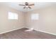 Neutral bedroom with hardwood floors and a ceiling fan at 1701 Nelson Ave, Indianapolis, IN 46203