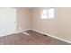 Empty bedroom with hardwood floors and a closet at 1701 Nelson Ave, Indianapolis, IN 46203