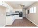 Bright kitchen with white cabinets and black appliances offers functionality and style at 1701 Nelson Ave, Indianapolis, IN 46203