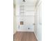 The laundry room is well-equipped with storage and room for laundry appliances at 1701 Nelson Ave, Indianapolis, IN 46203