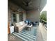 Covered back porch featuring comfortable patio furniture and scenic backyard views of the in-ground pool and gazebo at 1740 Golden Field Dr, Greenwood, IN 46143