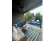 Covered back porch featuring comfortable patio furniture and scenic backyard views of the in-ground pool and gazebo at 1740 Golden Field Dr, Greenwood, IN 46143