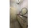 Modern bathroom featuring geometric wallpaper, granite countertop, and stylish black fixtures at 1740 Golden Field Dr, Greenwood, IN 46143