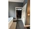 This bathroom boasts a view of a closet, stylish flooring, and is painted with a modern color at 1740 Golden Field Dr, Greenwood, IN 46143