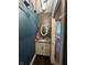 Stylish half bathroom featuring a granite countertop and dark teal painted walls at 1740 Golden Field Dr, Greenwood, IN 46143