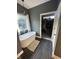 This bathroom features a luxurious soaking tub, chandelier, and stylish closet entrance at 1740 Golden Field Dr, Greenwood, IN 46143