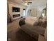 Comfortable bedroom featuring a fireplace, accent wall with TV, and plush carpeting at 1740 Golden Field Dr, Greenwood, IN 46143