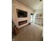 Comfortable bedroom featuring a fireplace, accent wall with TV, and plush carpeting at 1740 Golden Field Dr, Greenwood, IN 46143
