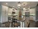Charming kitchen featuring a large island with bar seating, custom cabinetry, and modern appliances at 1740 Golden Field Dr, Greenwood, IN 46143