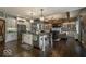 Bright and airy kitchen featuring a large island, stainless steel appliances and open to the cozy living room at 1740 Golden Field Dr, Greenwood, IN 46143