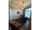 Bright home office featuring white brick wall, black desk, and natural light at 1740 Golden Field Dr, Greenwood, IN 46143