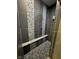 This shower features decorative tile accents, a convenient bench seat, and sleek, modern design at 1740 Golden Field Dr, Greenwood, IN 46143