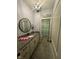 This bathroom features modern decor, granite countertop, and leads to a shower at 1740 Golden Field Dr, Greenwood, IN 46143