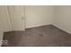 Bedroom showing gray carpet and a white door and trim, with an electrical outlet on the wall at 18 N Sherman Dr, Indianapolis, IN 46201