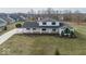 A bird's-eye view showcases this home's beautiful architecture and expansive green lawn in a peaceful neighborhood at 19041 Karyn Ln, Westfield, IN 46062