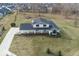 Stunning aerial perspective of the property's spacious lot, lengthy driveway, and proximity to neighboring homes and mature trees at 19041 Karyn Ln, Westfield, IN 46062