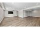 Finished basement area with vinyl flooring and a large TV at 19041 Karyn Ln, Westfield, IN 46062