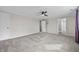 Spacious bedroom with neutral walls, carpet, ceiling fan, and adjoining rooms at 19041 Karyn Ln, Westfield, IN 46062