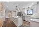 Well-lit kitchen featuring a center island, modern pendant lighting, and stainless steel appliances at 19041 Karyn Ln, Westfield, IN 46062
